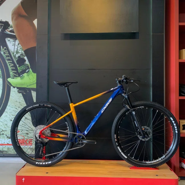 Bicicleta Oggi Agile Sport Aro 29 Deore 12v Azul Amarelo Vermelho