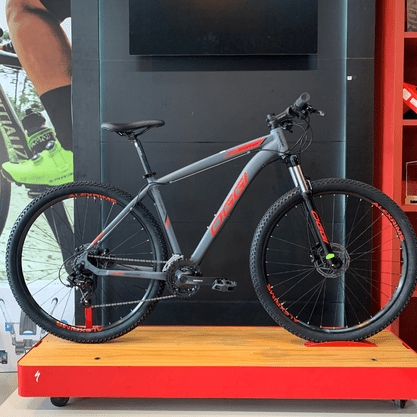 Bicicleta Oggi Hacker HDS Aro 29 Tourney 24v Grafite e Vermelho e Preto