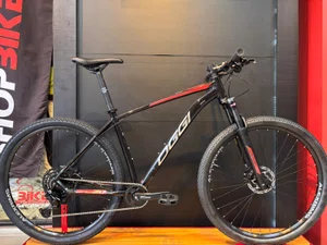 Bicicleta Oggi Big Wheel 7.0 Aro29 Cues 9v Preto e Vermelho 2026